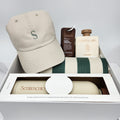 Product display with a beige cap, bottles, and a box on a white background