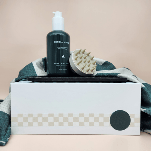 sentimento gift box closed with pamper pup products sitting ontop. Dog shampoo, brush, lick mat and towel.