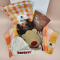 Thoughtfully curated dog gift box for pet parents featuring stylish and practical dog accessories.