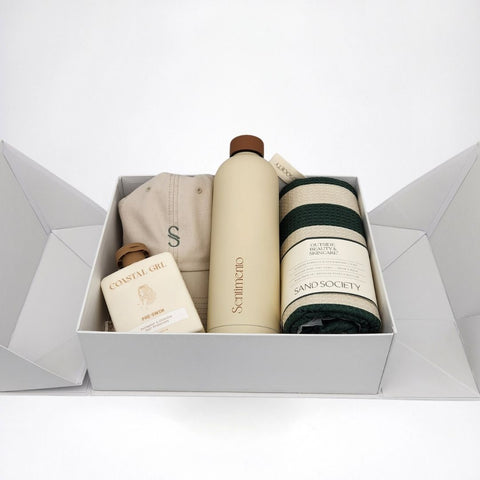 Open Summer Time gift box showing Sand Society towel, Coastal Grl hair mist, cotton hat and stainless steel bottle