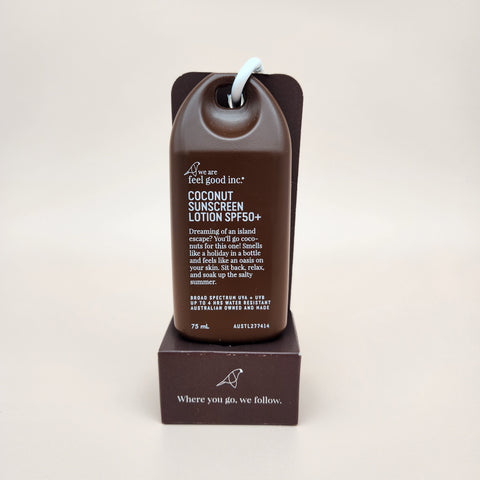 Coconut sunscreen lotion with packaging on a beige background